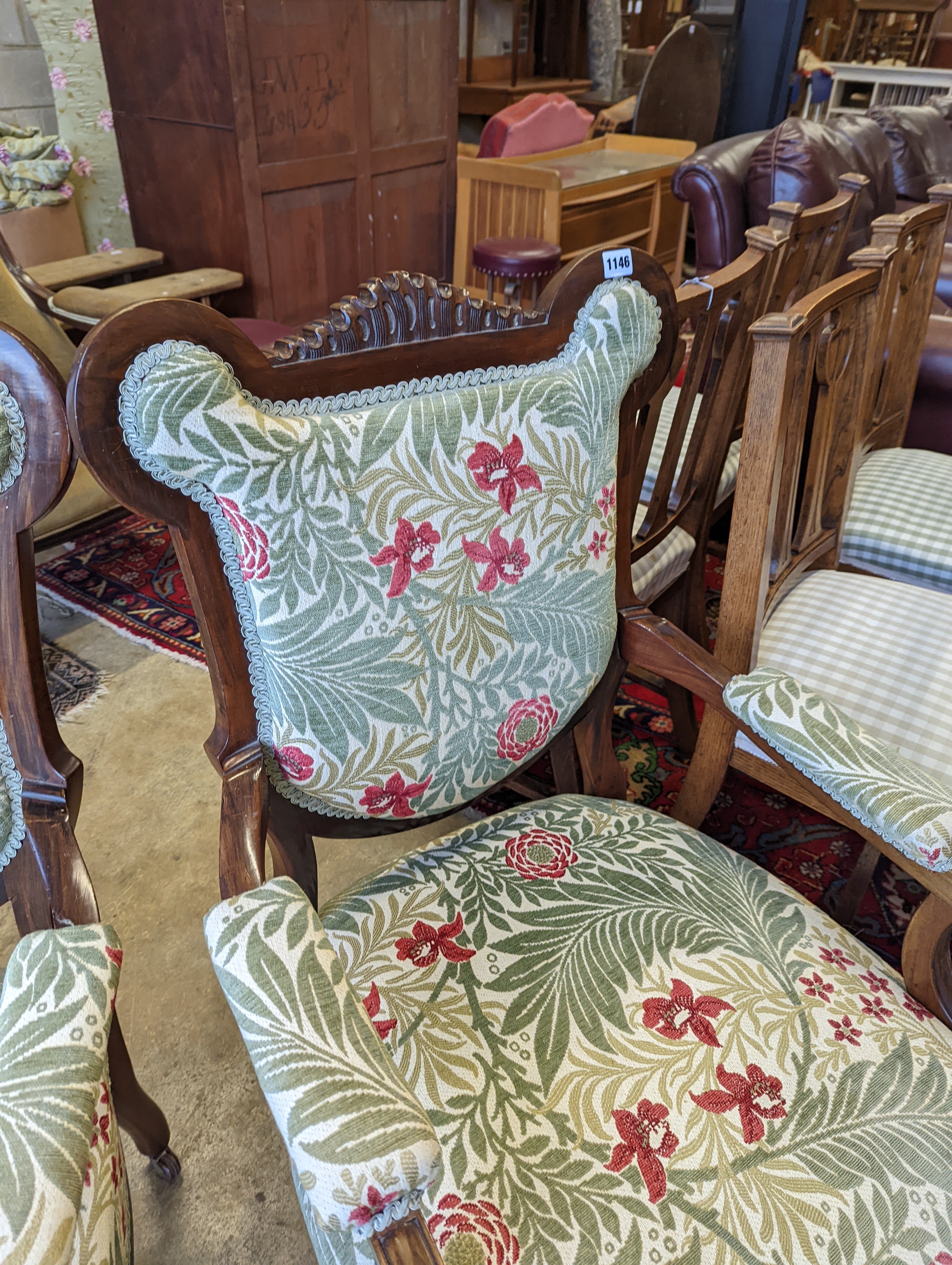 A pair of late Victorian mahogany upholstered drawing room chairs